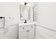 Stylish powder room featuring a sleek black faucet and a modern sink vanity at 3930 Peachtree Dunwoody Ne Rd, Atlanta, GA 30342