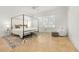 Bright bedroom with a canopy bed, decorative rug, and lots of natural light at 3930 Peachtree Dunwoody Ne Rd, Atlanta, GA 30342
