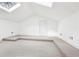 Bright bonus room with plush carpeting, tiered flooring, and natural light at 3930 Peachtree Dunwoody Ne Rd, Atlanta, GA 30342