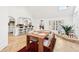 Inviting dining room adjacent to kitchen, featuring travertine floors and abundant natural light at 3930 Peachtree Dunwoody Ne Rd, Atlanta, GA 30342