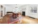 Dining room featuring hardwood floors, a fireplace, and traditional decor at 3930 Peachtree Dunwoody Ne Rd, Atlanta, GA 30342