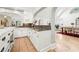 Kitchen showcasing a large island with drawers, tile floors, and an open archway to the next room at 3930 Peachtree Dunwoody Ne Rd, Atlanta, GA 30342
