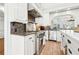 Gourmet kitchen featuring stainless steel appliances, granite countertops, and custom cabinetry at 3930 Peachtree Dunwoody Ne Rd, Atlanta, GA 30342
