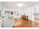 Elegant living room featuring hardwood floors, soft seating, and architectural arches at 3930 Peachtree Dunwoody Ne Rd, Atlanta, GA 30342