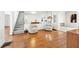 Spacious living room with hardwood floors and a staircase at 3930 Peachtree Dunwoody Ne Rd, Atlanta, GA 30342