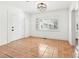 Room with tile floors, a large window, white walls and trim, and modern lighting at 3930 Peachtree Dunwoody Ne Rd, Atlanta, GA 30342
