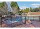 Backyard swimming pool surrounded by brick pavers and secured with a safety fence at 3930 Peachtree Dunwoody Ne Rd, Atlanta, GA 30342