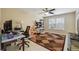 Office/flex space with ceiling fan, neutral walls, bright window, and patterned area rug at 2150 Waters Ferry Dr, Lawrenceville, GA 30043