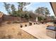 Spacious backyard features a concrete patio, ideal for entertaining and grilling at 3695 Townley Ln, Cumming, GA 30040