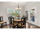 Cozy breakfast nook with bright windows overlooking the landscaped backyard and deck access at 3695 Townley Ln, Cumming, GA 30040