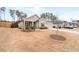 Charming single-story home with a manicured lawn, complemented by a driveway and other houses in the background at 3695 Townley Ln, Cumming, GA 30040