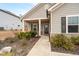 Inviting front entrance with a cozy porch, featuring a well-maintained walkway and landscaped shrubbery at 3695 Townley Ln, Cumming, GA 30040