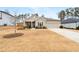 Well-manicured front lawn complements this single-story home, complete with a driveway and attached garage at 3695 Townley Ln, Cumming, GA 30040