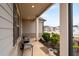 Cozy front porch furnished with comfortable seating, complemented by trimmed shrubs and residential views at 3695 Townley Ln, Cumming, GA 30040