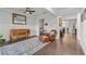 An inviting living room with hardwood floors, a ceiling fan, and tasteful furniture atop a patterned area rug at 3695 Townley Ln, Cumming, GA 30040