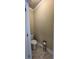 Small half bathroom with toilet and flooring at 922 Golden Meadows Ln, Loganville, GA 30052