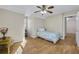 Bedroom with hardwood floors, a ceiling fan, and a window with natural light at 5450 Taylor Rd, Johns Creek, GA 30022