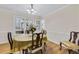 Dining room features wood floors, chair railing, and natural light at 5450 Taylor Rd, Johns Creek, GA 30022