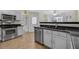 Bright kitchen showcases granite counters, stainless appliances, and a view to the breakfast nook at 5450 Taylor Rd, Johns Creek, GA 30022