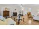 Cozy living room with hardwood floors, fireplace, and view of dining room at 5450 Taylor Rd, Johns Creek, GA 30022