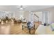 Spacious living room with hardwood floors flows into the dining area and features French doors to foyer at 5450 Taylor Rd, Johns Creek, GA 30022