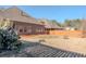 Spacious backyard with brick home exterior and wooden fence at 2733 Madison Mae Ln, Grayson, GA 30017