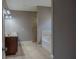 Bathroom featuring a double vanity, soaking tub, and tiled shower, providing a luxurious and functional space at 2733 Madison Mae Ln, Grayson, GA 30017