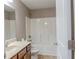 Bathroom with vanity, toilet and shower-tub combination at 2733 Madison Mae Ln, Grayson, GA 30017