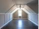 Bright bonus room with hardwood floors, dormer window, and beadboard paneling at 2733 Madison Mae Ln, Grayson, GA 30017