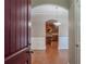 Inviting entryway with arched doorway, hardwood floors, and view of the kitchen at 2733 Madison Mae Ln, Grayson, GA 30017