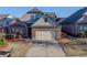 Charming two-story home with a brick and gray facade and well-manicured lawn at 2733 Madison Mae Ln, Grayson, GA 30017