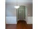 Hallway with wainscoting and hardwood flooring at 2733 Madison Mae Ln, Grayson, GA 30017