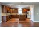 Open concept kitchen with stainless steel appliances, a kitchen island, and hardwood floors at 2733 Madison Mae Ln, Grayson, GA 30017