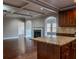 Open kitchen with granite countertops, dark wood cabinets, and coffered ceilings at 2733 Madison Mae Ln, Grayson, GA 30017