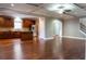 Open-concept living space with hardwood floors connects to the kitchen, perfect for entertaining and everyday living at 2733 Madison Mae Ln, Grayson, GA 30017