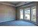 Carpeted bedroom with a trey ceiling and large windows offering ample natural light at 2733 Madison Mae Ln, Grayson, GA 30017