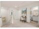 Bright hallway featuring a functional desk, carpet floors, and neutral paint at 305 Sound Cir, Stockbridge, GA 30281