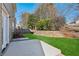 Landscaped backyard with patio and retaining wall at 4345 Settlers Grove Rd, Cumming, GA 30028