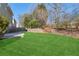 Spacious backyard with a grassy area and trees at 4345 Settlers Grove Rd, Cumming, GA 30028