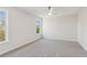 Bright bedroom featuring neutral walls and new carpeting at 4345 Settlers Grove Rd, Cumming, GA 30028