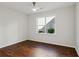 Bright bedroom with hardwood floors and large window at 4345 Settlers Grove Rd, Cumming, GA 30028