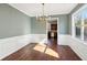 Elegant dining room with hardwood floors and wainscoting at 4345 Settlers Grove Rd, Cumming, GA 30028