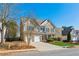 Two-story brick home with a large front yard and attached two-car garage at 4345 Settlers Grove Rd, Cumming, GA 30028