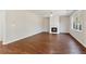 Gathering room featuring hardwood floors and a gas fireplace at 4345 Settlers Grove Rd, Cumming, GA 30028