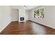 Cozy Gathering room with hardwood floors and fireplace at 4345 Settlers Grove Rd, Cumming, GA 30028