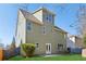 Two-story house with a light green exterior and a patio at 4345 Settlers Grove Rd, Cumming, GA 30028
