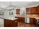 Spacious kitchen with island, stainless steel appliances, and wood flooring at 4345 Settlers Grove Rd, Cumming, GA 30028