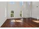 Spacious living room featuring hardwood floors and high ceilings at 4345 Settlers Grove Rd, Cumming, GA 30028