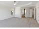Large main bedroom with carpet and access to bathroom at 4345 Settlers Grove Rd, Cumming, GA 30028