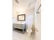 Modern bathroom with gray vanity and marble-look tile floor at 110 Randomwood Way, Alpharetta, GA 30022